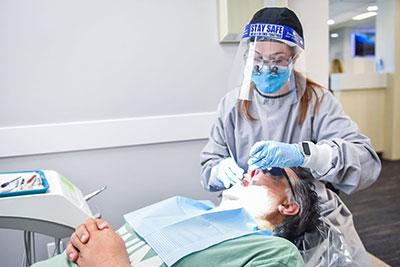 patient receiving a gentle root canal during their visit to Strathcona Dental Clinic in Edmonton, AB
