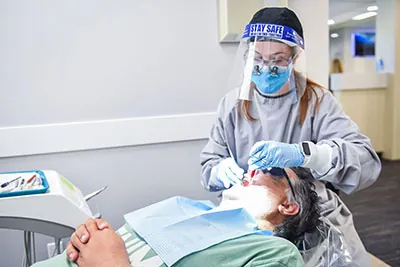 patient receiving a gentle root canal during their visit to Strathcona Dental Clinic in Edmonton, AB